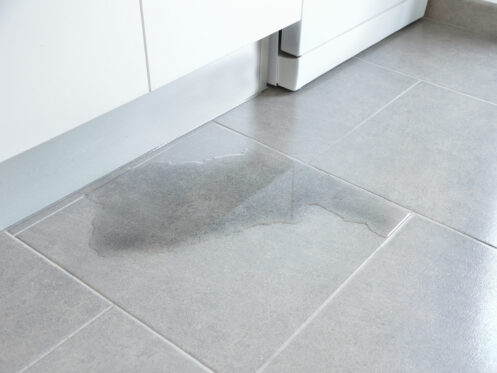 Water coming from the wall in the kitchen