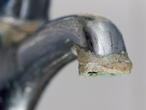 A faucet with hard water scaling
